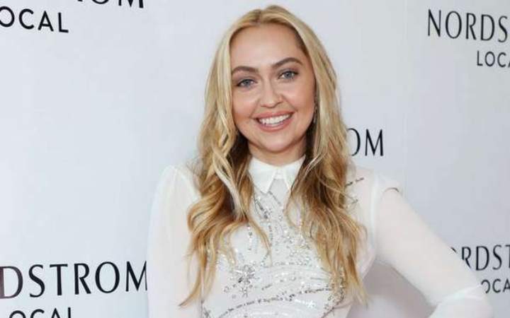 Brandi Glenn Cyrus posing for a photoshoot.